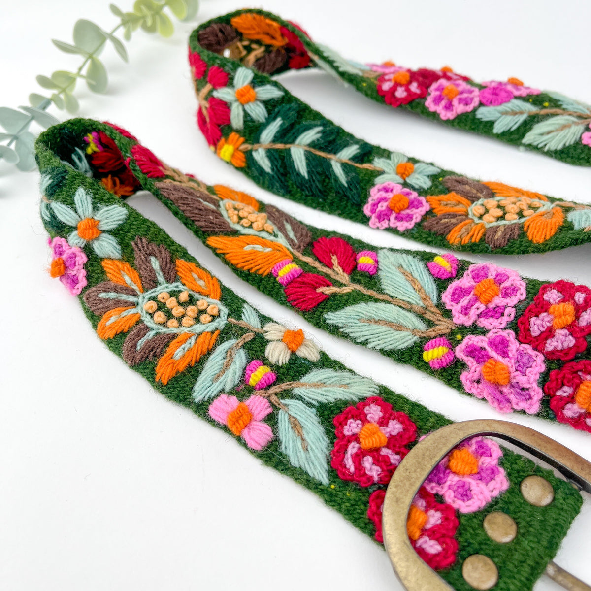 Embroidered floral straps with a white background